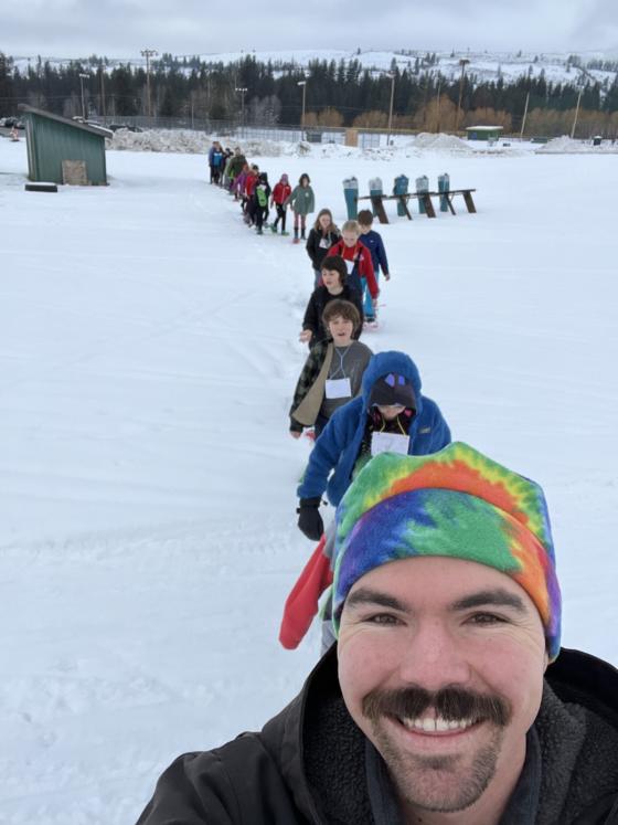 Bridger and line of snowshoers
                                